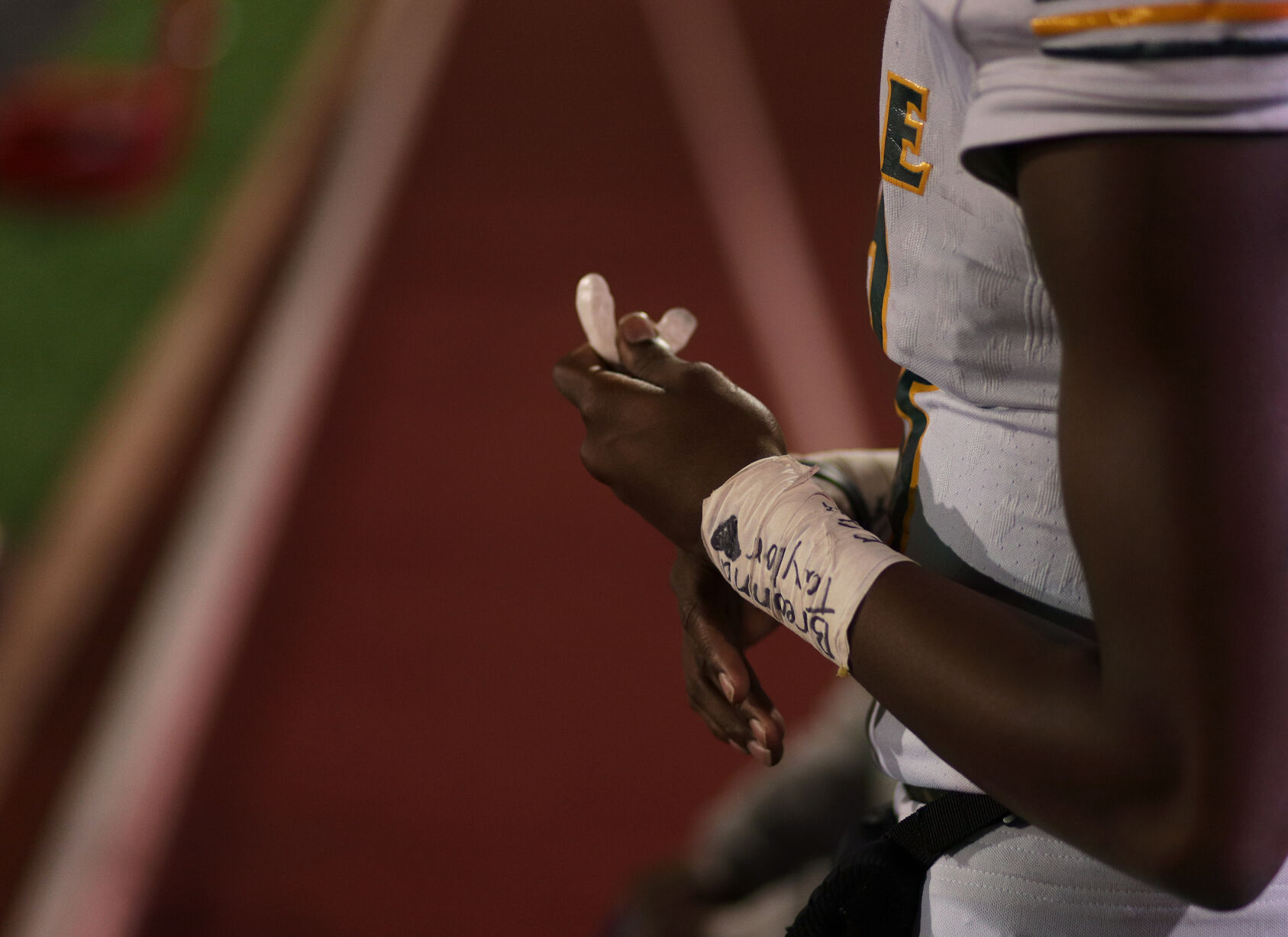 Battle senior Khaleel Dampier fiddles with his mouthpiece